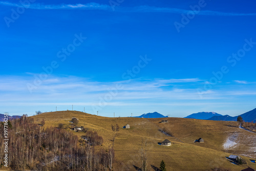 Beautiful mountain landscape in the Carpathian Mountains Romania at the transition from autumn to winter.