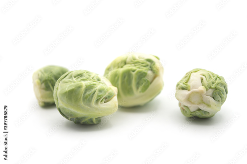 Fototapeta premium Closeup of organic brussels sprouts on white background