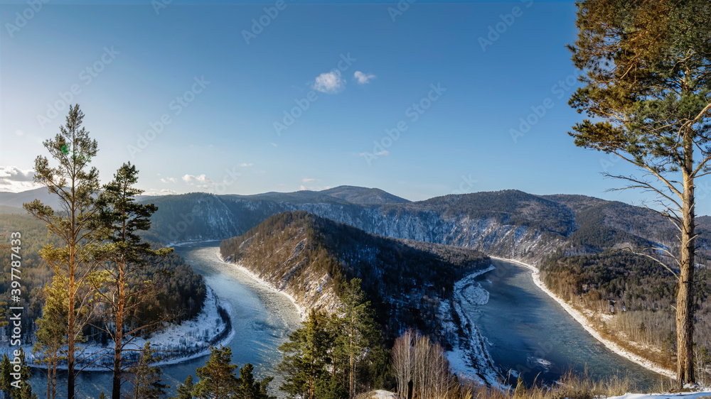 view of the freezing Manu river in autumn from the mountain. Nature of Siberia, beautiful landscape