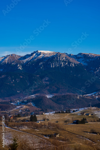 Beautiful mountain landscape in the Carpathian Mountains Romania at the transition from autumn to winter.