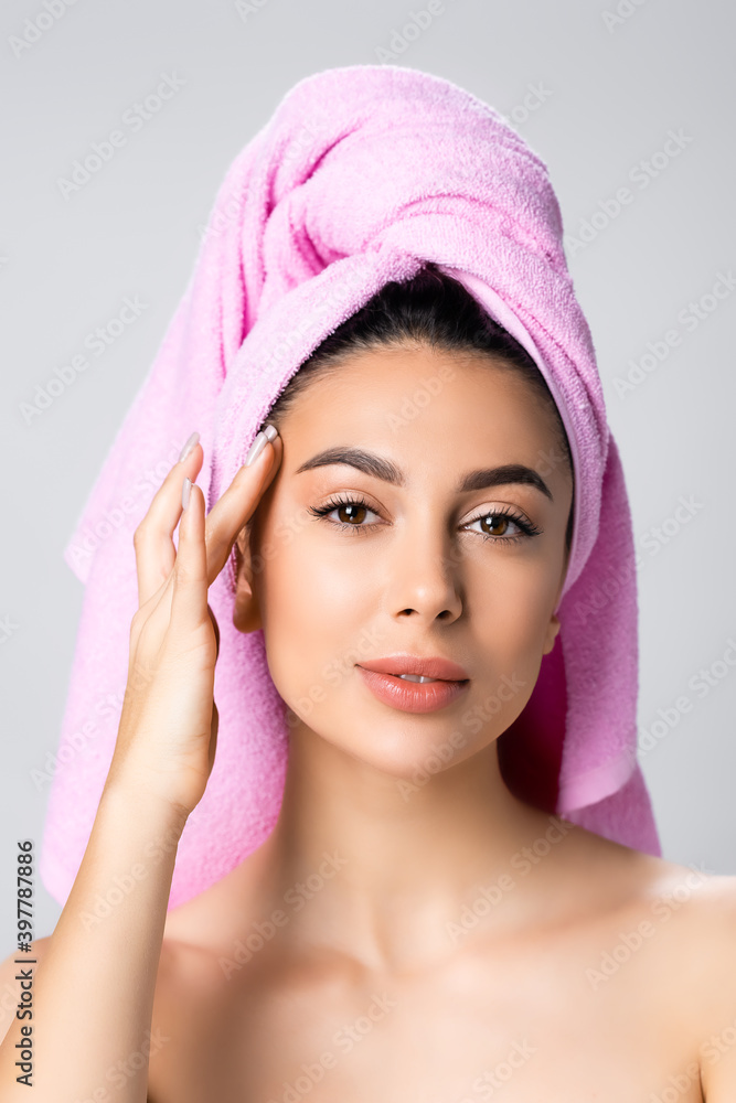 beautiful woman with towel on hair isolated on grey beautiful woman with towel on hair isolated on grey