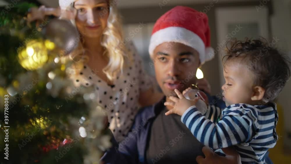Young family of three celebrating Christmas Young family of three celebrating Christmas