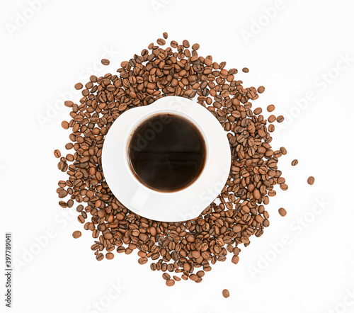 Top view with coffee cup and roasted coffee beans stock photo. Coffee cup and roasted coffee beans on white background