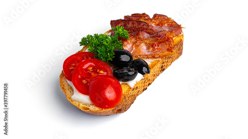 Bruschetta with bacon and vegetables on a white background. High quality photo
