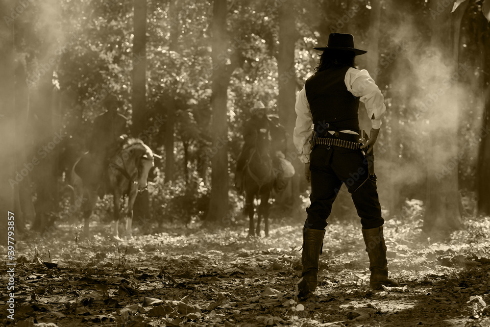 Obraz premium Vintage portrait of three cowboy men riding a gunfighting horse. In a forest