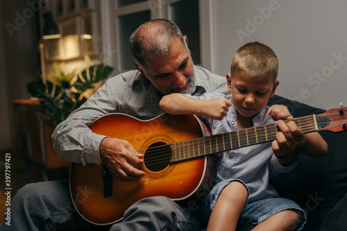 grandfather and his grandson having fun together at home