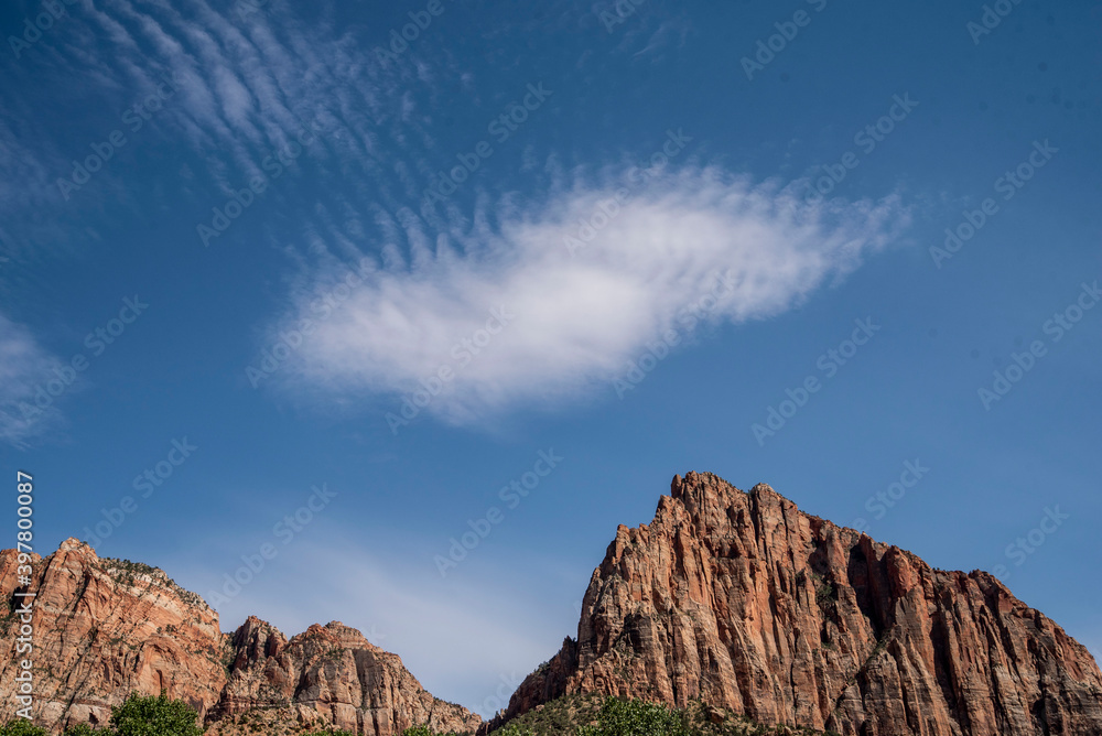 clouds above red rock desert in capital reef