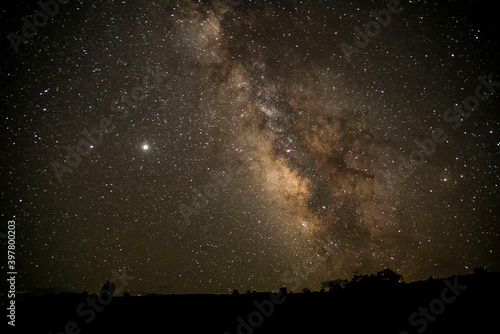 starry night sky above desert landscape