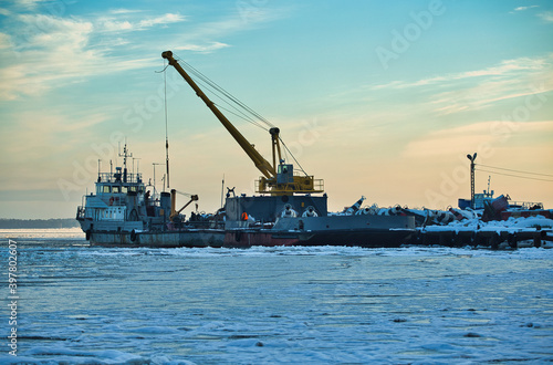 Crane on the ship. Crane loading. Port crane in winter. 