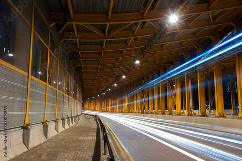 light trails and head lights of traffic in tunnel. Transportation background