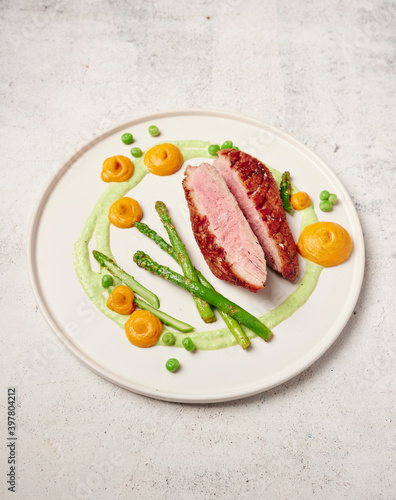 Duck breast with asparagus and pumpkin puree
