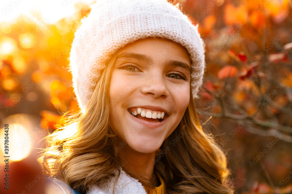 Close up portrait of a young girl in warm hat Close up portrait of a young girl in warm hat