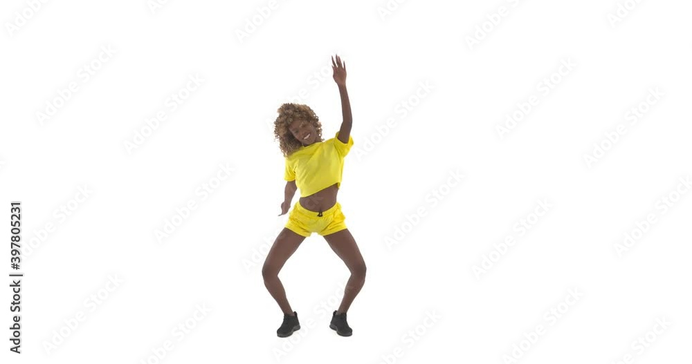 Young curly African American woman vigorously dancing, jumping and raising arms in rotation. Isolated on white background with copy space Young curly African American woman vigorously dancing, jumping and raising arms in rotation. Isolated on white background with copy space