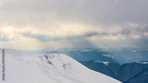 Sunset over a snow-covered ridge. © Oleksiy