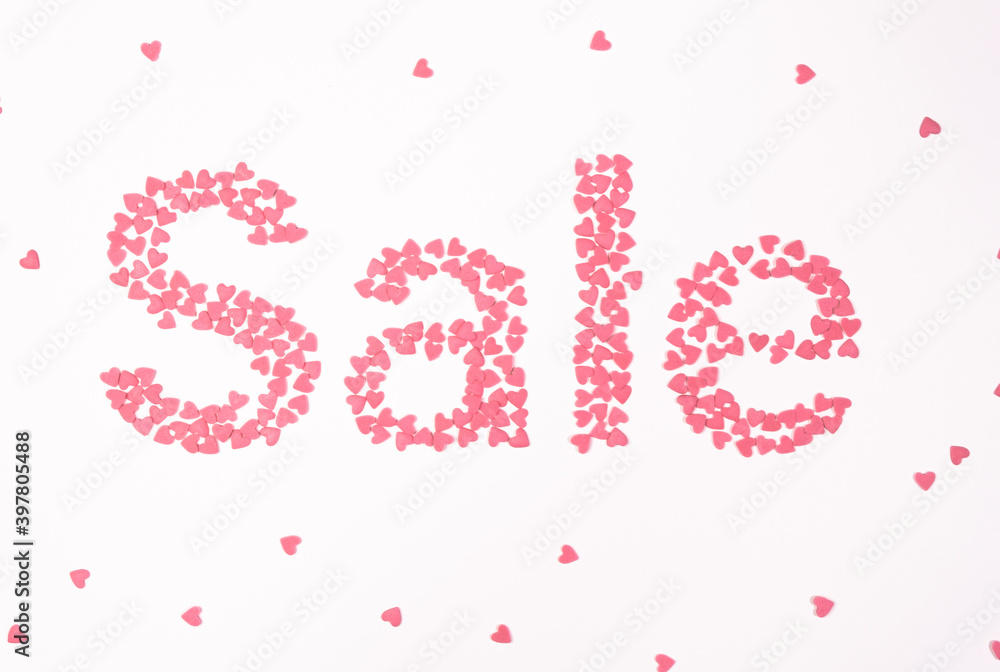 Sale, pink hearts on white background top view Sale, pink hearts on white background top view