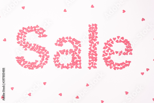 Sale, pink hearts on white background top view