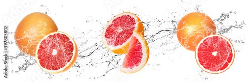 Fresh Grapefruits with water splash on isolated white background