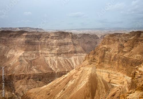 Red-brown sheer walls of the mountain canyon.