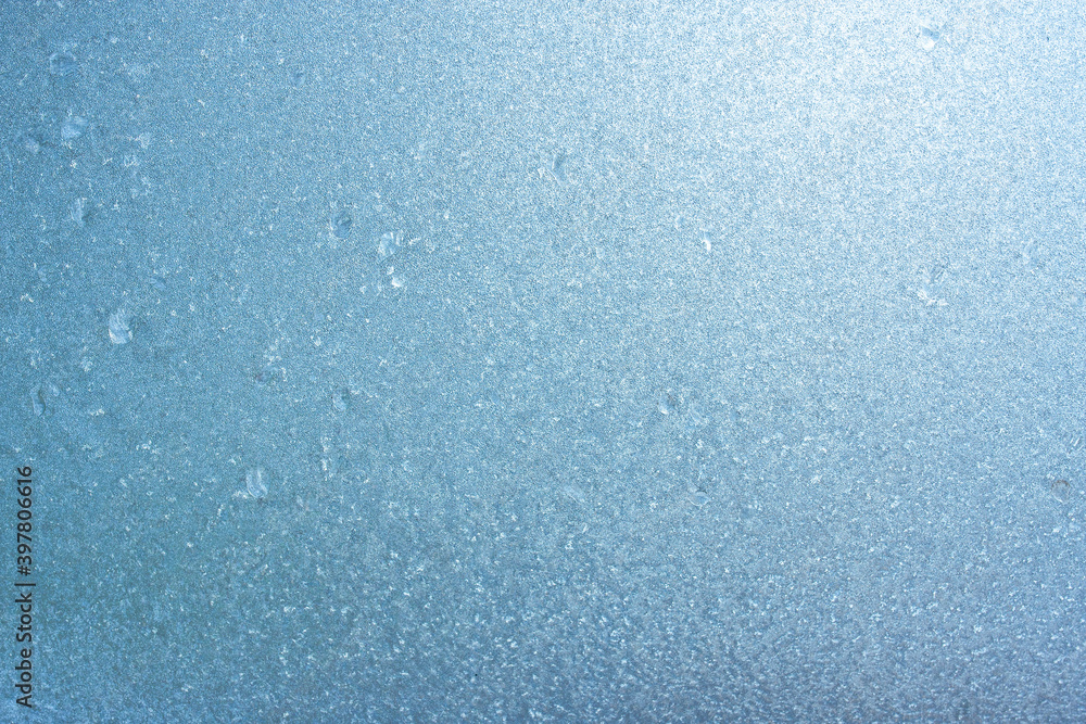 Winter background on a transparent glass of a window with a frozen texture. Abstract texture background, horizontal image, copy space for your design or text Winter background on a transparent glass of a window with a frozen texture. Abstract texture background, horizontal image, copy space for your design or text