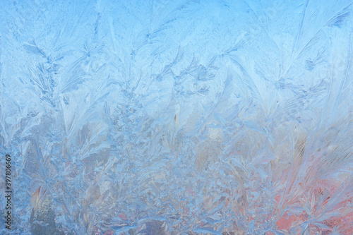 Winter background on a transparent glass of a window with a frozen texture. Abstract texture background  horizontal image  copy space for your design or text