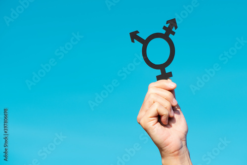 person showing a transgender symbol