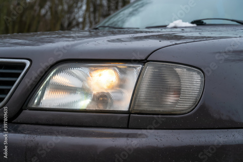 Close-up of the car's fog lights. Headlights in the car, close-up. Close-up of white car headlights. Passing beam. Left headlight