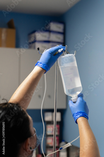 Nurse placing physiological saline solution