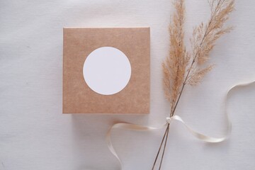 Round sticker mockup on gift box, wedding favor box and blank sticker label, adhesive address label, thank you tag.