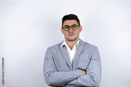 Business young man wearing a casual shirt over white background smiling confident showing teeth with arms crossed