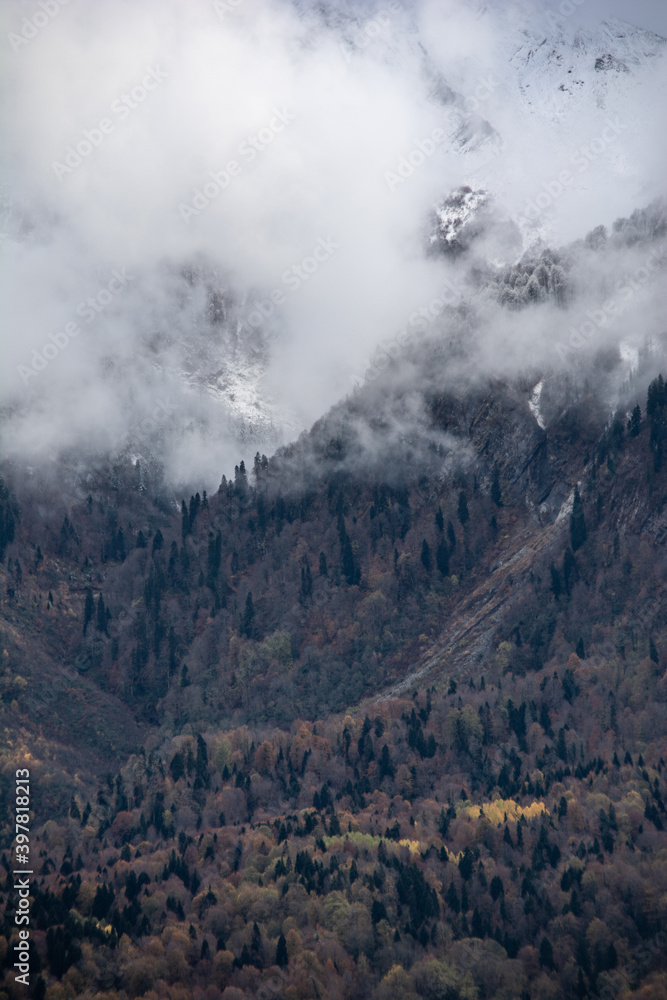 Winter mountains in the clouds. Beautiful mountain landscape