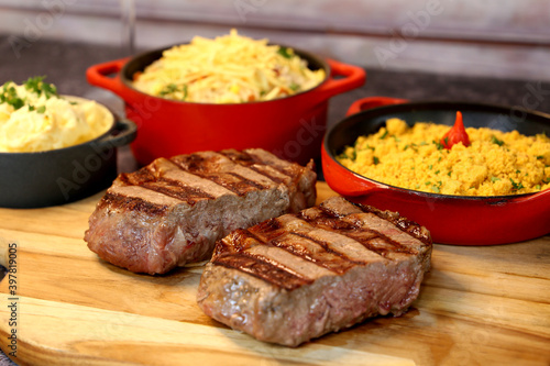 Rib Eye steak grilled in barbecue grill. With excellent accompaniment to meats.