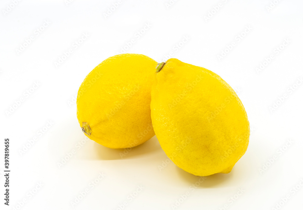 Isolated lime or yellow lemon on white background, two limes are put together.