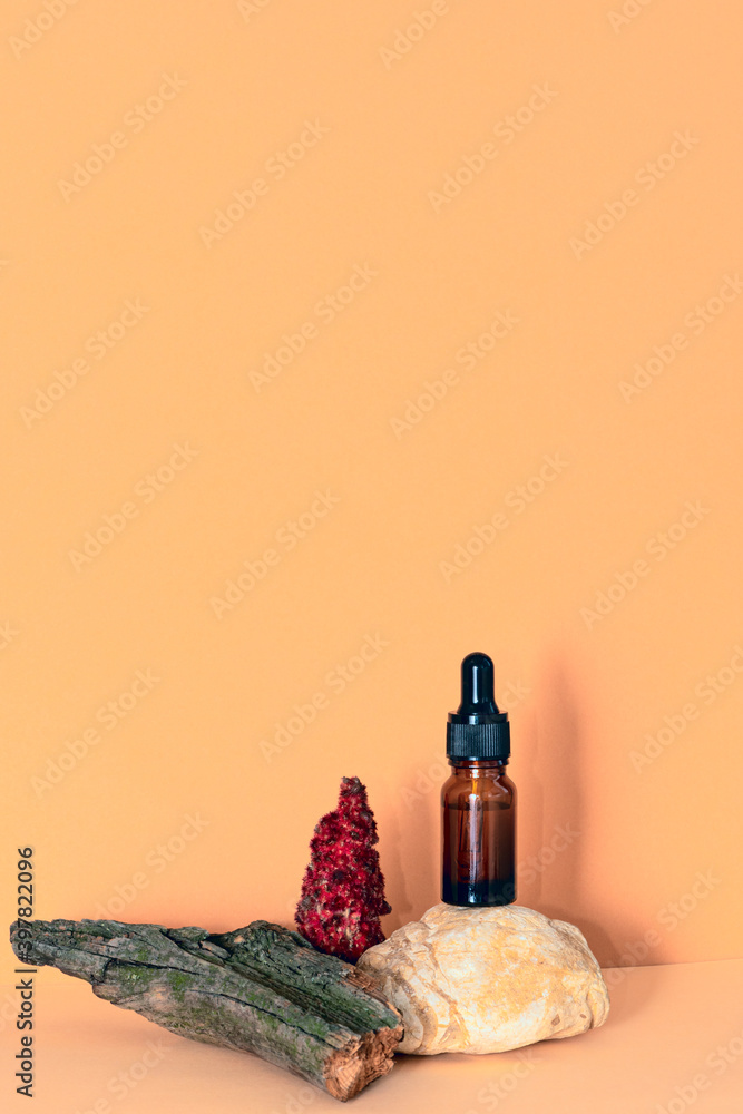 Serum, essential oil, fluid collagen in brown dropper glass bottle on beige background. Organic, bio, natural cosmetic. Beauty, Spa, skincare concept. Mockup for branding. Copy space.