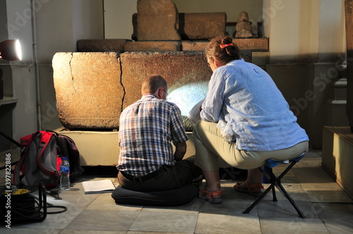Egyptologists deciphering hieroglyphs in the Egyptian Museum, Cairo