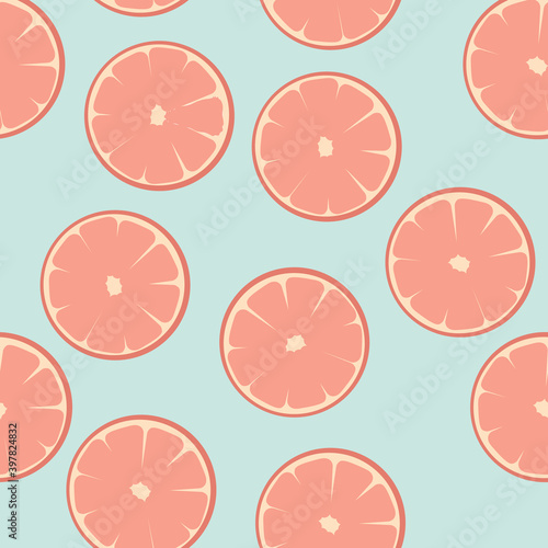 Seamless pattern with grapefruit, orange, citrus. Vector illustration. Citrus slices on a blue background. For textiles and printing.