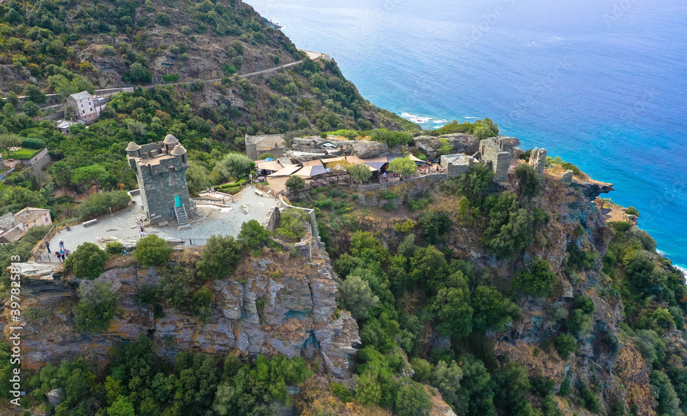 Mountain village of Nonza and the Genoese tower with a view over the Mediterranean Sea to Cap Corse, Corsica, France