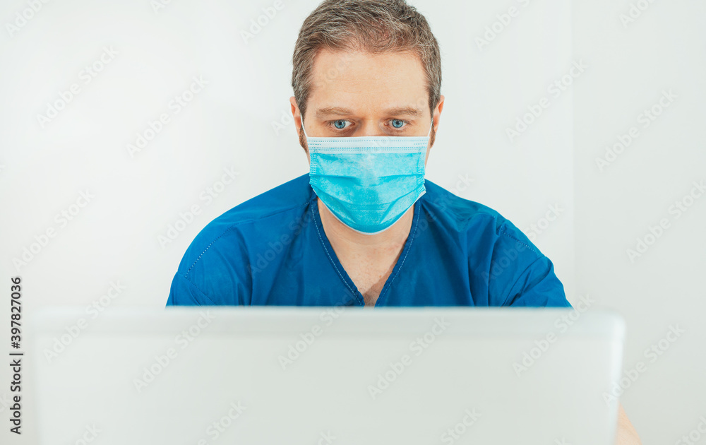 Medical doctor in protective mask having video conference with patient. Medical doctor in protective mask having video conference with patient.