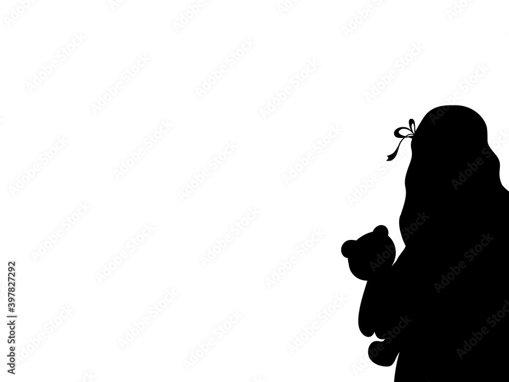 Silhouette of girl with toy bear