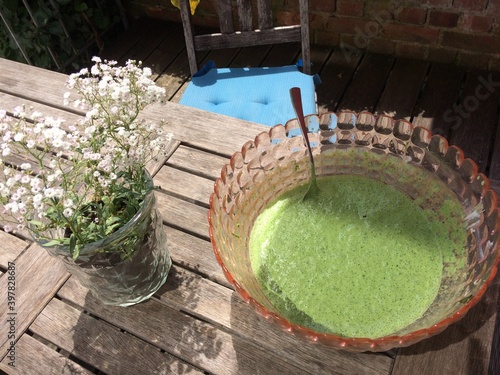 green sauce on a wooden table in summer