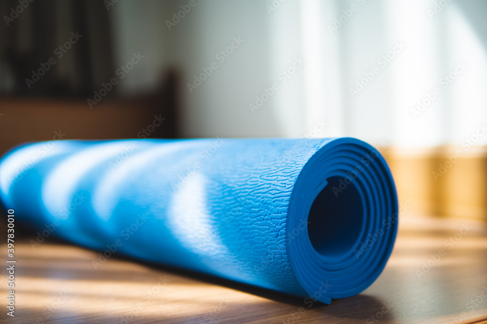ํYoga mat Exercise mat on the floor with sunlight in the morning at home ํYoga mat Exercise mat on the floor with sunlight in the morning at home
