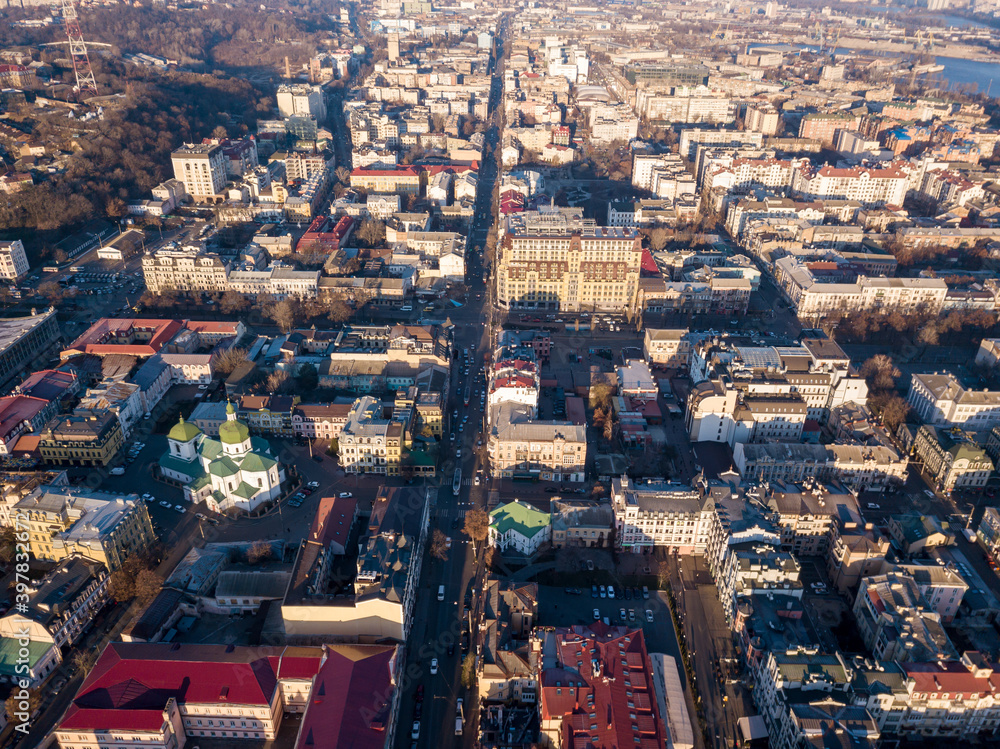 Aerial drone view. Streets of the historical center of Kiev - Podil on a sunny morning.