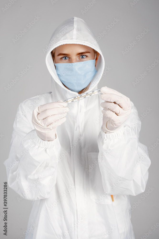 Doctor in a medical mask. Coronavirus theme. Isolated over white background. Woman in a protective suit. Doctor in a medical mask. Coronavirus theme. Isolated over white background. Woman in a protective suit.