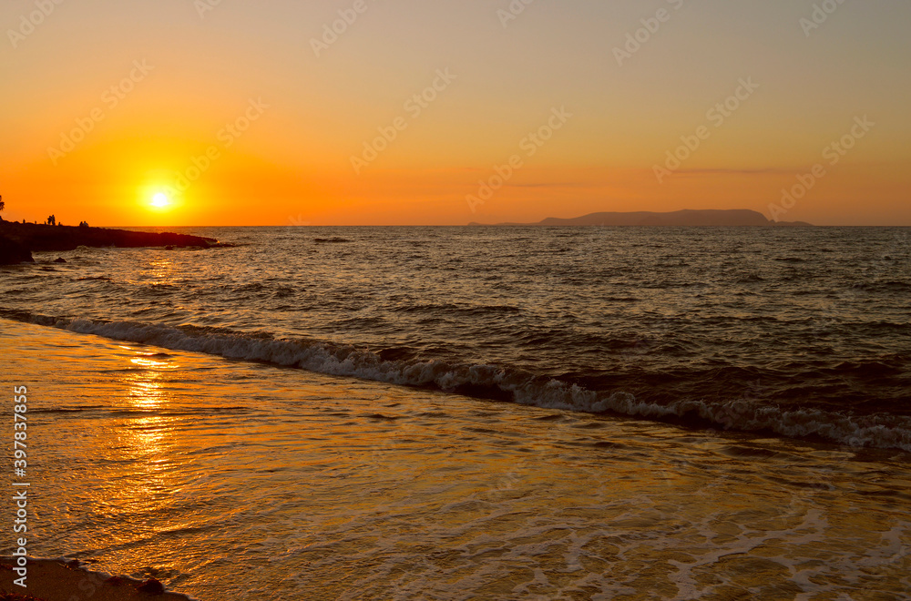 Sunset over Kato Gouves beach