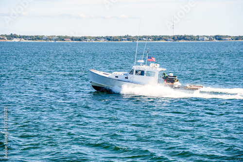 Fishing boat in navigation off the coast of Cape Cod, MA, in autumn