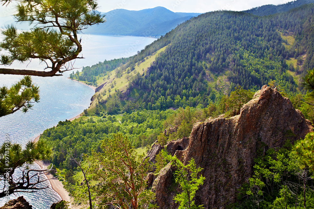 Beautiful view from the cliff-top Skriper. Sunny summer day on the lake Baikal, Russia.  