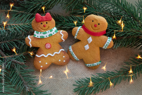 Christmas gingerbread cookies under the Christmas tree with lights