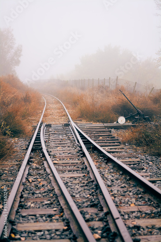 Train tracks on a foggy day