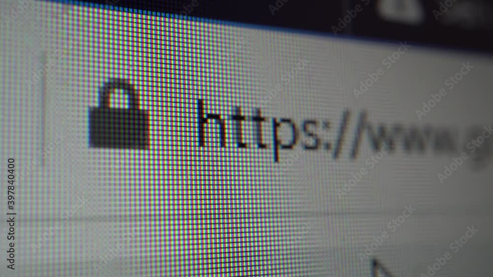 Close-up view on LCD monitor. User is entering web site address in broswer. Https protocol, security and privacy concept.