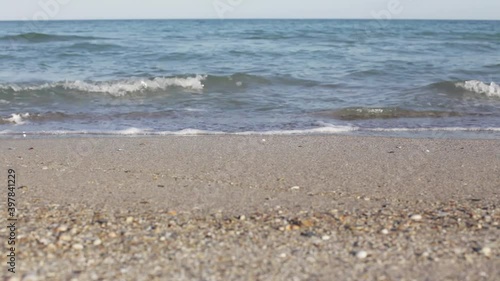 horizontal dolly shot follow on of a beach and sea shore