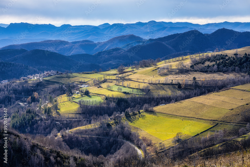 Naklejka premium Nice hills in spanish Pyrenees mountain in a winter day like autumnal.